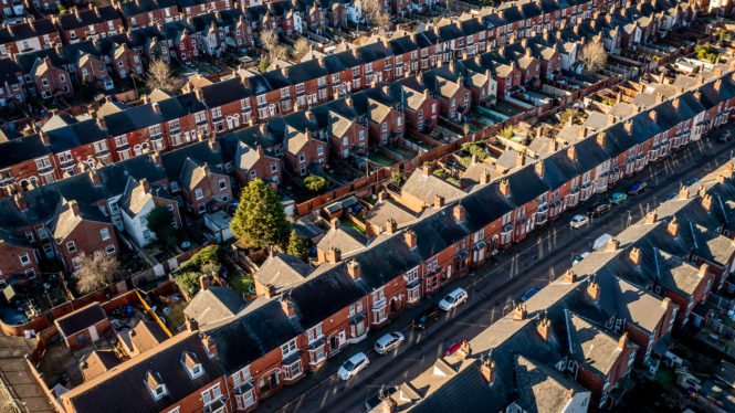 An aerial view of rows of back to back terraced houses in a working class area of a Northern town in England