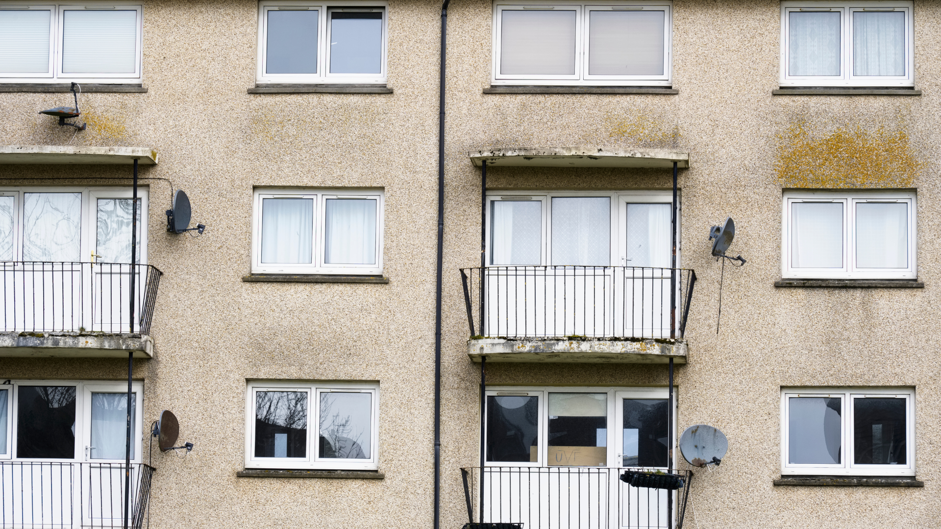 The outside of a run down block of flats